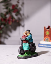 Elderly Couple on Bicycle Statue