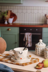 Alamkari India Ceramic Pretty Face shaped Cup & Saucer