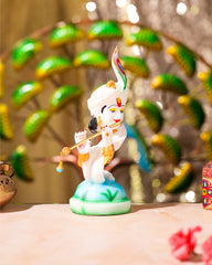 White Krishna Idol on Peacock Feather Base
