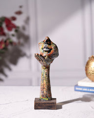 Hand Holding Face Sculpture - Multicolour