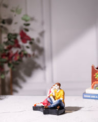Romantic Couple Sitting Together Statue