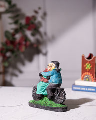 Elderly Couple on Bicycle Statue
