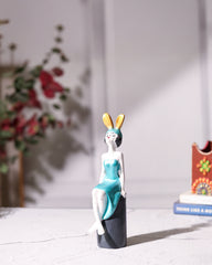 Seated Girl Figurine with Bunny Ears